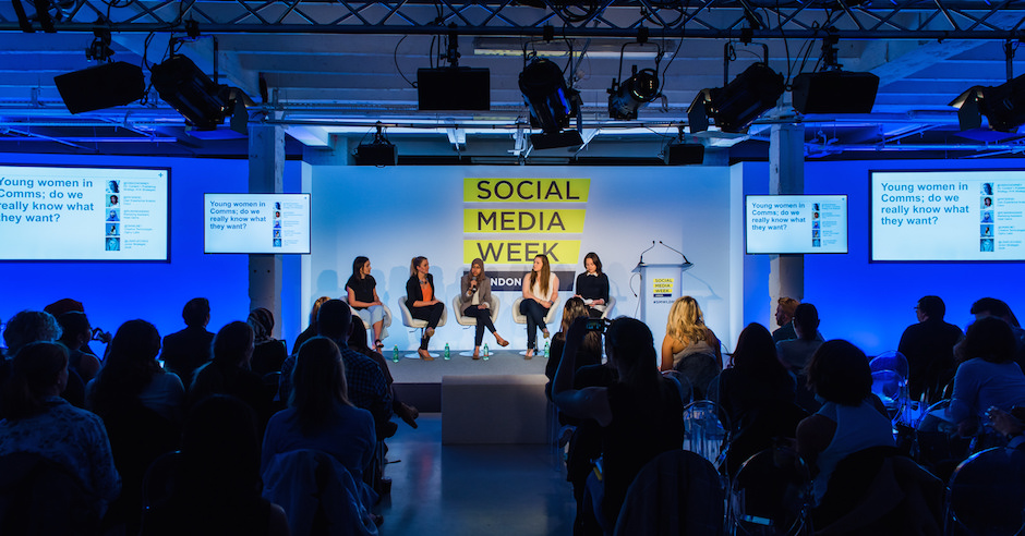 Panel discussion on stage at a Social Media Week conference